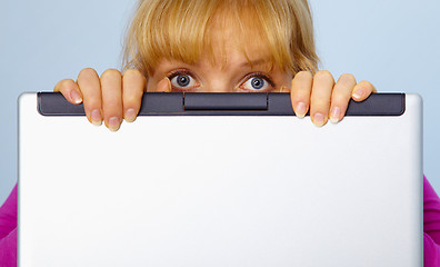 Image showing Woman was guilty and hides behind a computer