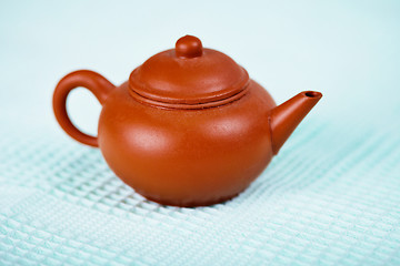 Image showing Old brown ceramic pot on towel