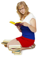 Image showing Young woman reading a book