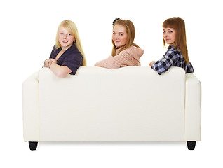 Image showing Three girls teens sitting on the couch