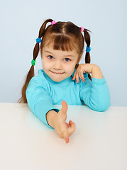 Image showing Funny little girl shows a finger