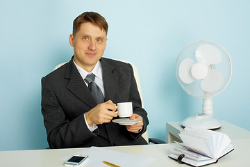 Image showing Attractive young man with a cup of coffee