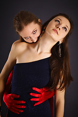 Image showing Two young girls portrayed vampire and sacrifice