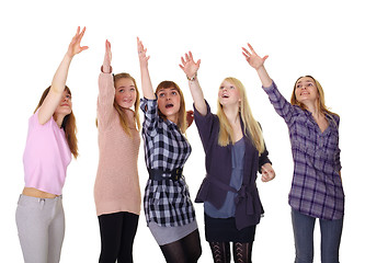 Image showing Girls pulling together hands up isolated on white background