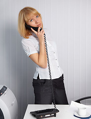 Image showing Young woman calls by phone