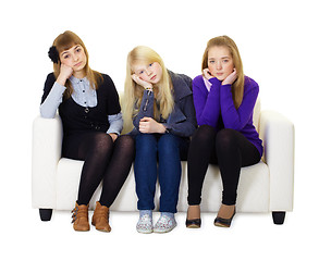 Image showing Young girls are sad sitting on couch