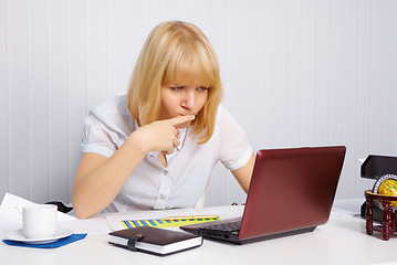 Image showing Young woman working in office