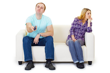 Image showing Husband and wife in a quarrel sit on couch watching TV