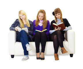 Image showing Three girls teen carefully read the books