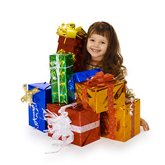 Image showing Happy child and big heap of gifts