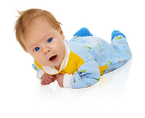 Image showing Six months child lying on floor isolated on white