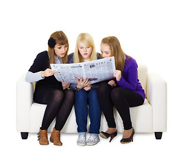 Image showing Three girlfriends teen read the newspaper