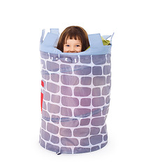 Image showing Little girl hides in toy basket