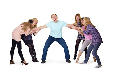 Image showing Girls pull man's hands