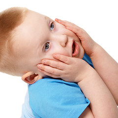 Image showing Little boy emotionally grabbed hold of face