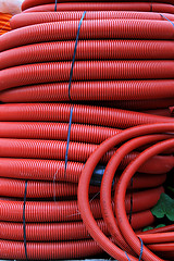 Image showing Red hose coils