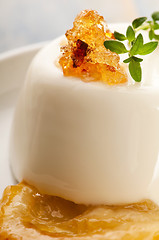 Image showing Vanilla Panna Cotta Dessert with lemon and fresh herbs