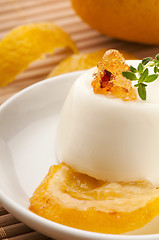 Image showing Vanilla Panna Cotta Dessert with lemon and fresh herbs