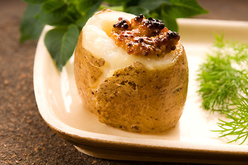 Image showing Baked potato with sour cream, grain Dijon mustard and herbs