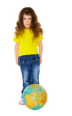 Image showing Funny girl with a globe like a soccer ball
