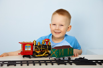 Image showing Boy playing with toy railway