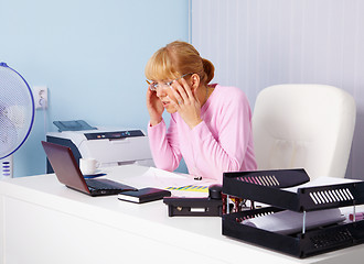 Image showing Busy blonde in office workplace