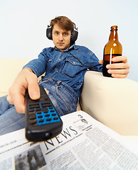 Image showing Young man watching TV