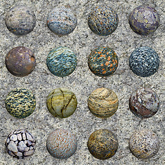 Image showing Set of stone balls on granite wall - seamless texture