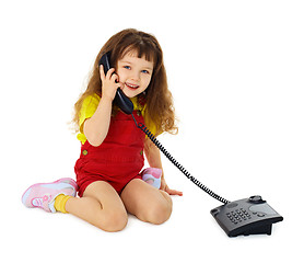 Image showing Little girl talking on phone