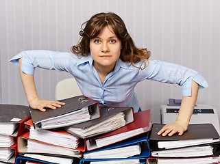 Image showing Serious chief accountant at workplace with documents