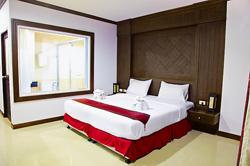 Image showing Interior of a room in hotel. Large bed.