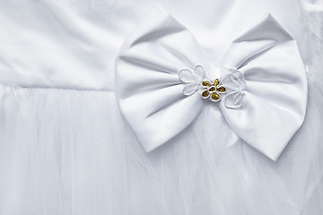 Image showing Bow decorating the white dress