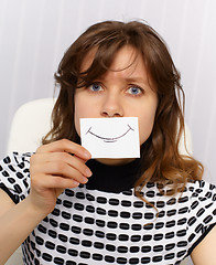 Image showing Woman with very unnatural smile on face