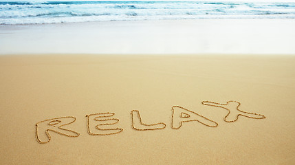 Image showing Inscription on beach sand - relax