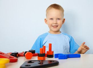 Image showing Happy child playing with toys
