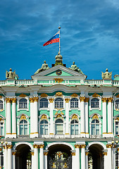 Image showing Old European palace with Russian flag