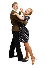 Image showing Dancing couple dressed in 60s