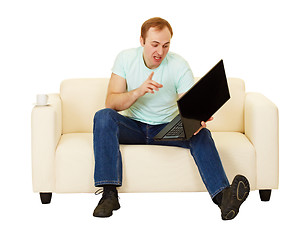 Image showing Man was talking with computer on the couch