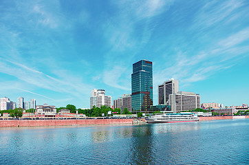 Image showing High-rise building on riverbank. Urban landscape