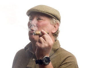Image showing handsome middle age man smoking cigar