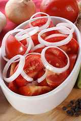 Image showing fresh summer salad with tomatoes and onion rings