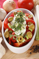 Image showing Mediterranean tomato salad with olives and garlic