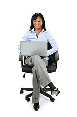 Image showing Businesswoman sitting in office chair with computer