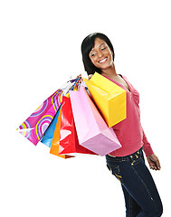 Image showing Young smiling black woman with shopping bags