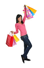 Image showing Excited young black woman with shopping bags