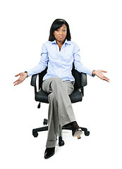 Image showing Shrugging businesswoman in office chair