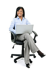 Image showing Businesswoman sitting in office chair with computer