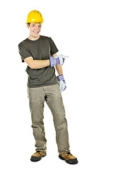 Image showing Smiling construction worker pointing to the side