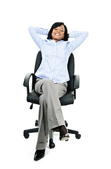 Image showing Relaxed businesswoman sitting on office chair