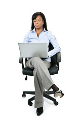 Image showing Woman sitting in office chair with computer